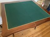 an image of a table with a green cloth on it