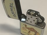 a lighter with a camel on it on a white surface