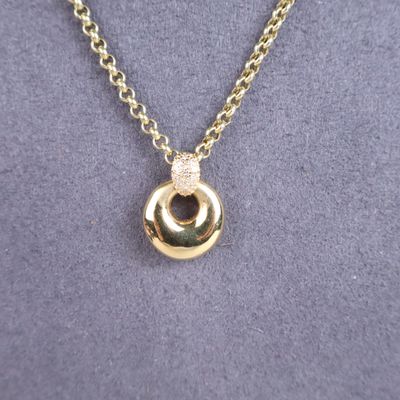 a close up of a gold necklace on a mannequin mannequin mannequin mannequin mannequin mannequin mannequin manne