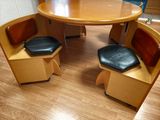 two chairs and a table in the corner of a room