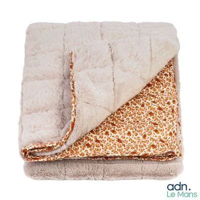 an image of a blanket with a giraffe print on it