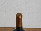a bottle of wine that is sitting on a table