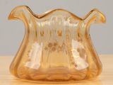 a glass vase that is sitting on a table