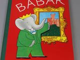 the book is red with a picture of an elephant in a green suit