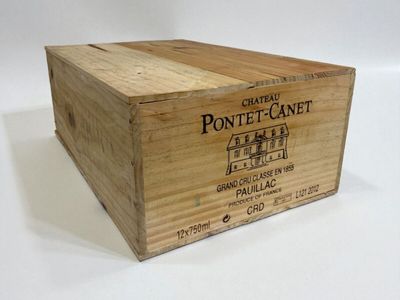 a wooden box with a label on it on a white surface