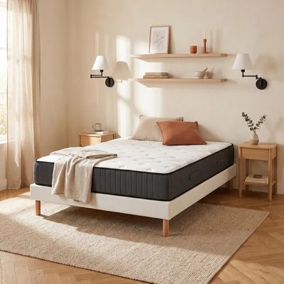 an image of a bedroom with a bed and a window