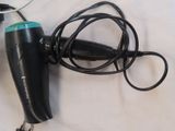 a hair dryer and a hair dryer sitting on a table