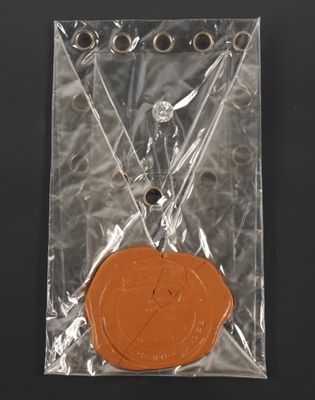a wax seal on top of a plastic bag