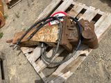 a wooden pallet with a hammer and a sign on it