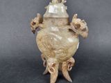 a picture of a very old looking vase on a table
