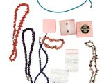 a lot of items that are laying out on a white surface
