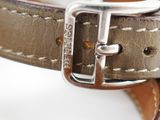 a close up of a leather belt with a buckle on it