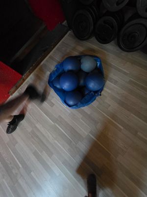 a man that is standing on a hard wood floor