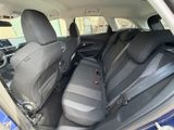 the back seats of a blue car are empty and ready to be used