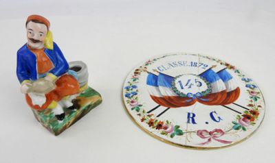 DIVERS. Soliflore en porcelaine figurant un zouave assis, H:…