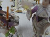 three figurines that are sitting on a table