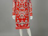 a red and white dress with a paisley pattern on it