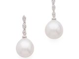 a pair of pearl and diamond earrings