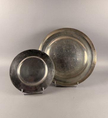 a silver plate and a silver plate on a white background