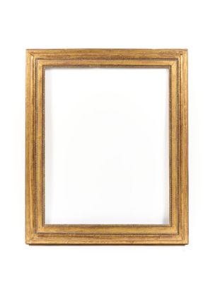 a gold frame on a white wall with a white background
