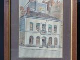 painting of a building with a clock on top of it on a wooden easel