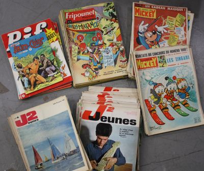 beaucoup de bandes dessinées posées par terre les unes à côté des autres