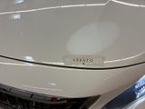 a close up of a car ' s hood with a sticker on it