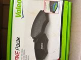 a box with a pair of brake pads inside of it