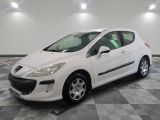 a picture of a white car parked in a garage