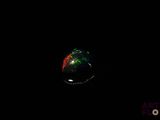 an image of a black background with a ring in the dark