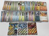 a close up of a collection of pokemon cards on a table