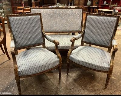 two chairs and a table in a room with a lot of furniture