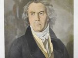 an old picture of a man in a black coat and white shirt