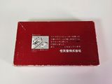 an image of a red business card sitting on top of a white table