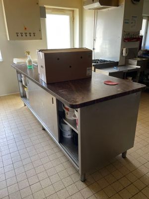 a large kitchen island with a box on top of it