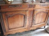 a wooden cabinet that has a clock on top of it