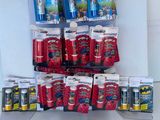 a lot of toothbrushes, toothpaste, and toothpaste bags on a shelf