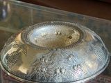 a glass table with a bowl on top of it