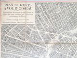 un journal sur lequel figure un plan de Paris