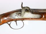 an old gun that is on display in a museum