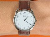 the wrist of a person with a watch on it ' s wrist