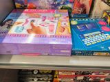 many toys on the shelf in the store