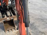 a red bulldozer that is sitting in the dirt