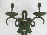 two candles that are on the wall in the room