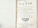 someone is holding a book open to a page with a picture of a bird on it