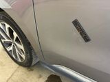 a sticker on the side of a car that has a hole in it