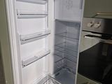 an image of an open refrigerator in a kitchen