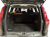 the back of a car with the trunk open and luggage in the trunk