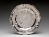 a silver plate that is sitting on a table
