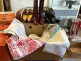a box full of shoes and other items in a room